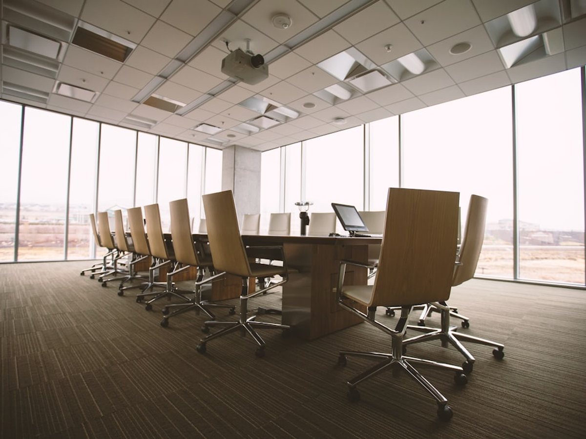 Boardroom set for a meeting with the lake beyond