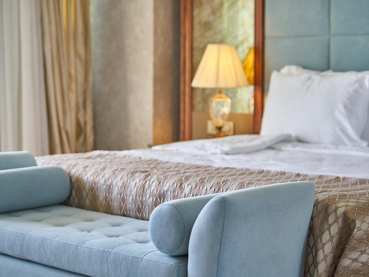 Suite bedroom with a wide window over the lake